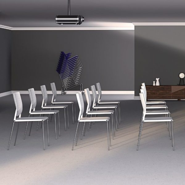 White plastic café chairs suitable for commercial office spaces and training areas that can be staked to 20 chairs high.