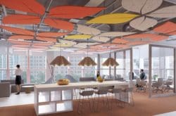 White, orange and yellow leaf-shaped ceiling rafts as a funky office interior design feature over an open plan office