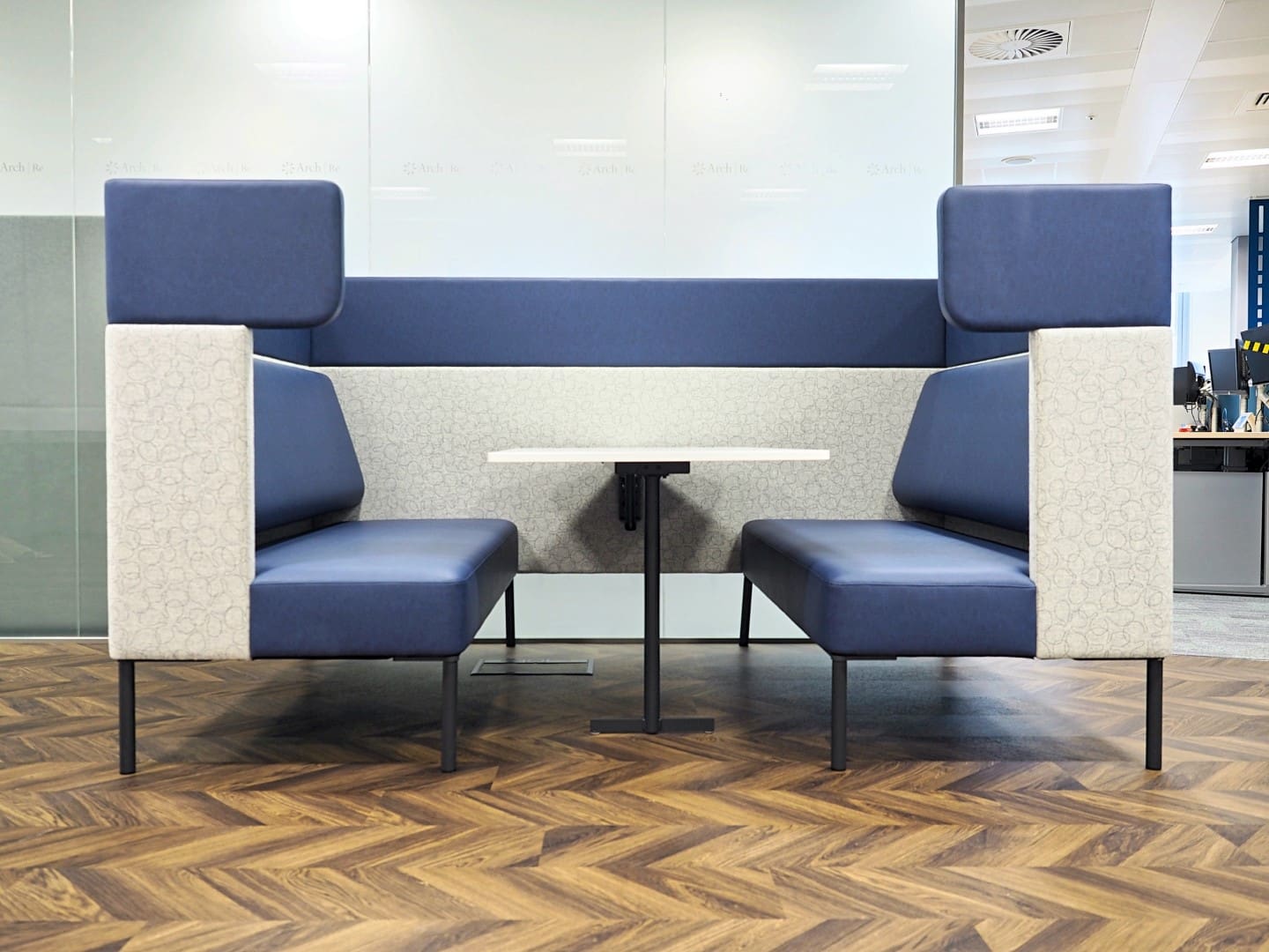 An office booth with soft leather seating