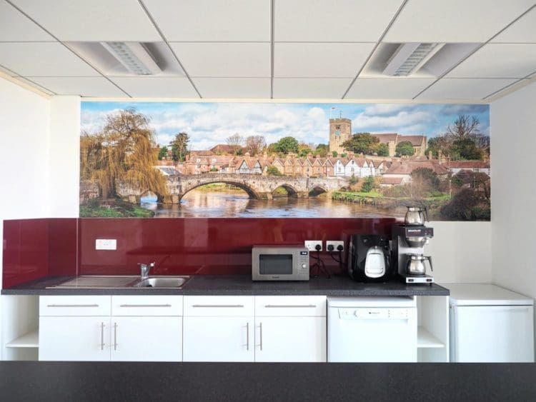 An office kitchen with a printed mural of Aylesford bridge in Kent