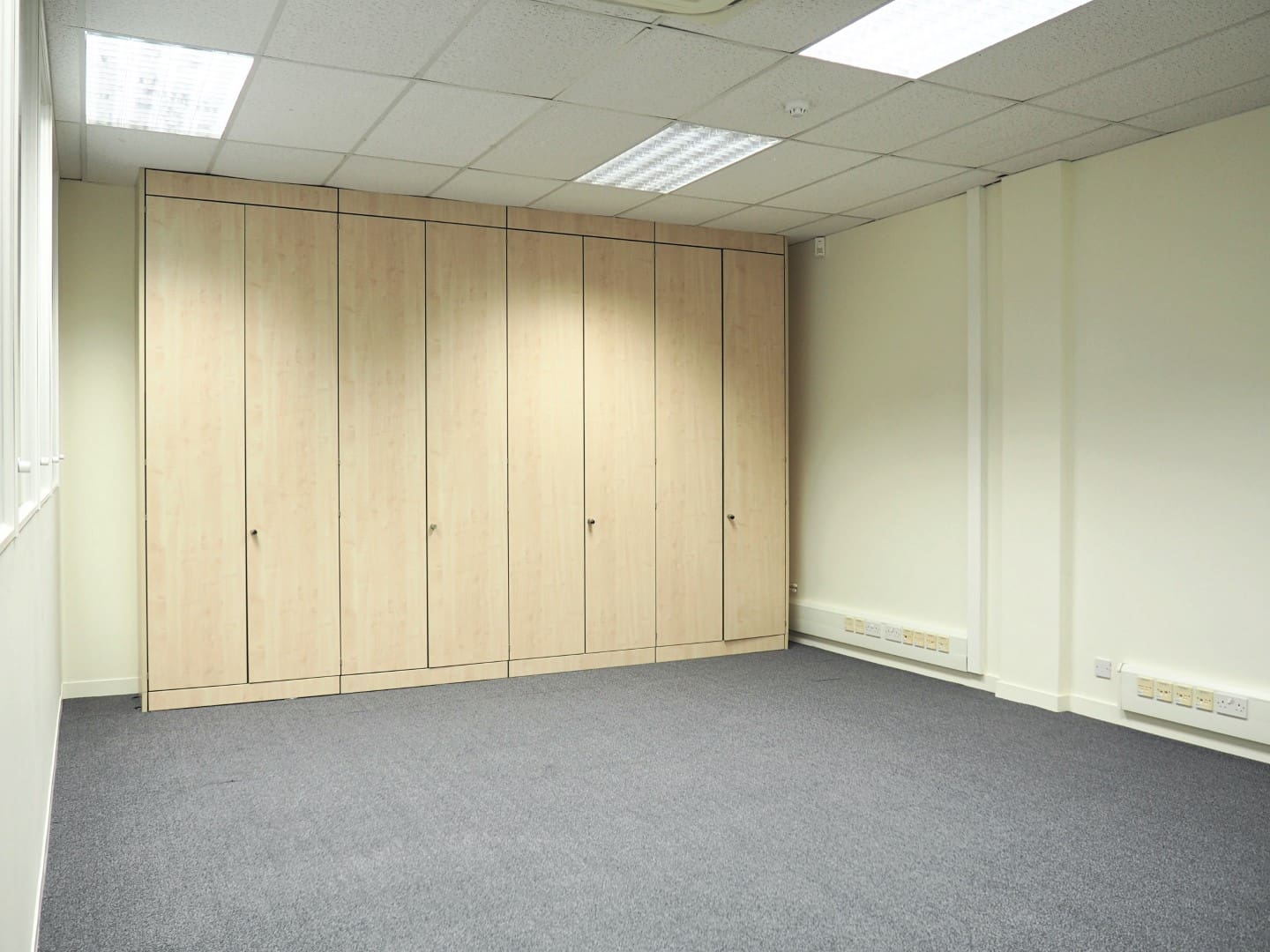 Ceiling height storage for coats installed for a classroom fit out in Kent