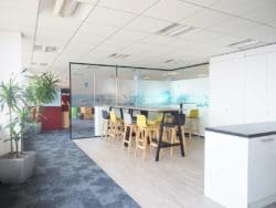 The new Tony Gee office design in Ashford with breakout area dining furniture and glass partitions