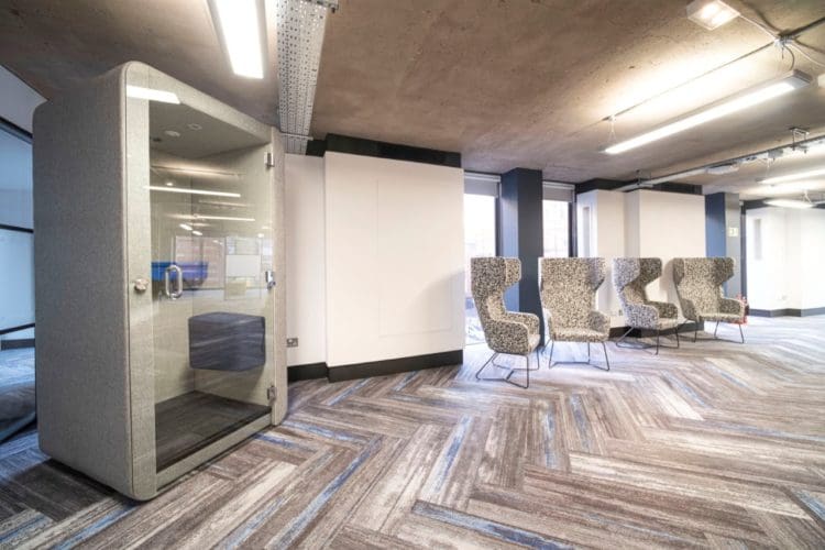 Glass fronted soundproof booth installed for an office fit out project