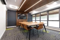 Eco friendly office design with wooden slats and boardroom table