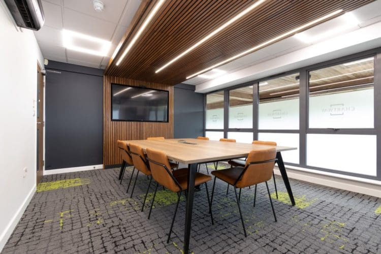 Eco friendly office design with wooden slats and boardroom table