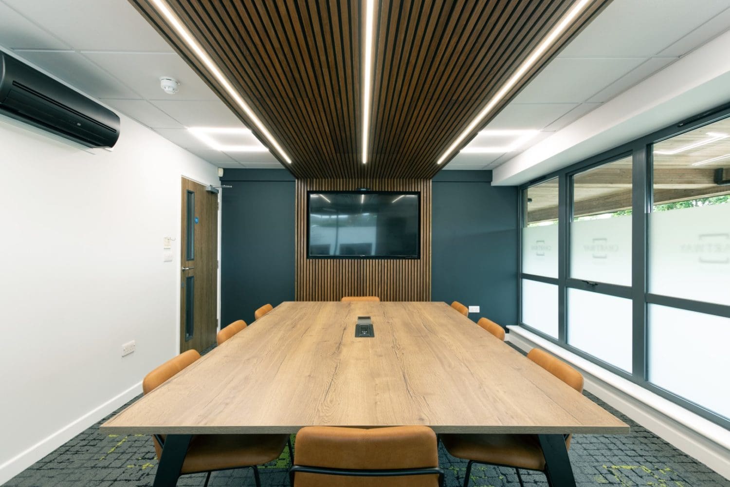 Corporate office meeting room interior design with wooden raft ceiling