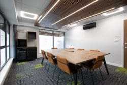 Office boardroom with glass manifestation and beer fridge