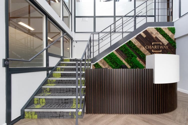 Sustainable office reception interior design with a moss wall