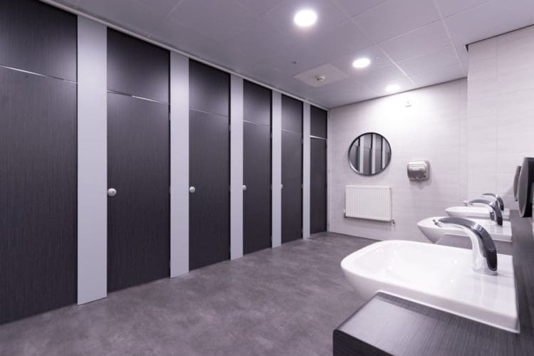 School toilet cubicles with downlights and motion sensor taps