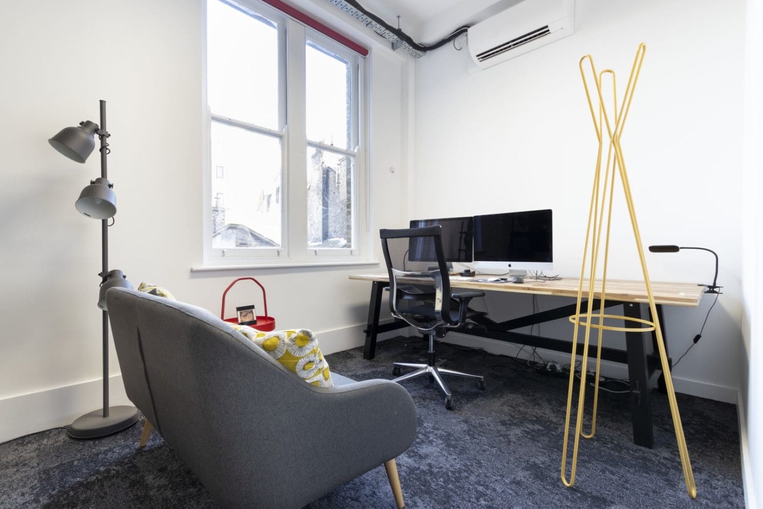 Soundproof office production suite with Mac computers and soft furnishings