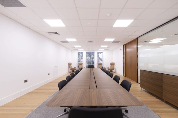 Corporate office boardroom table with power at WE Soda in London