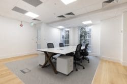 Four person office desk with integrated power