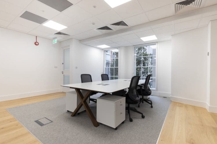 Four person office desk with integrated power
