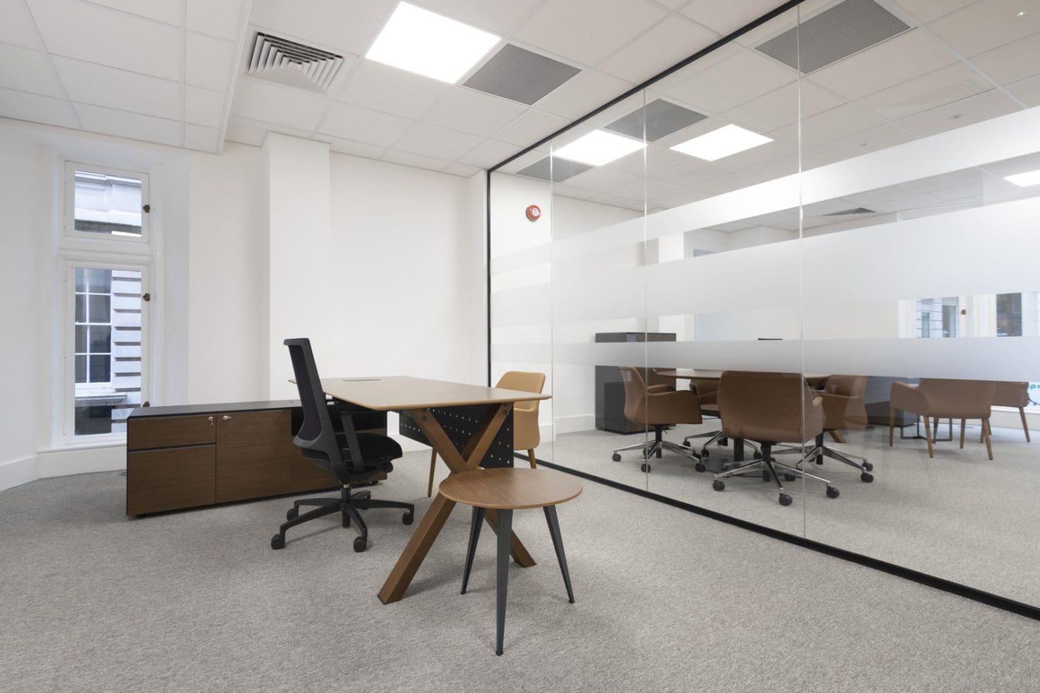 Modern corporate office interiors with a seamless glass partition