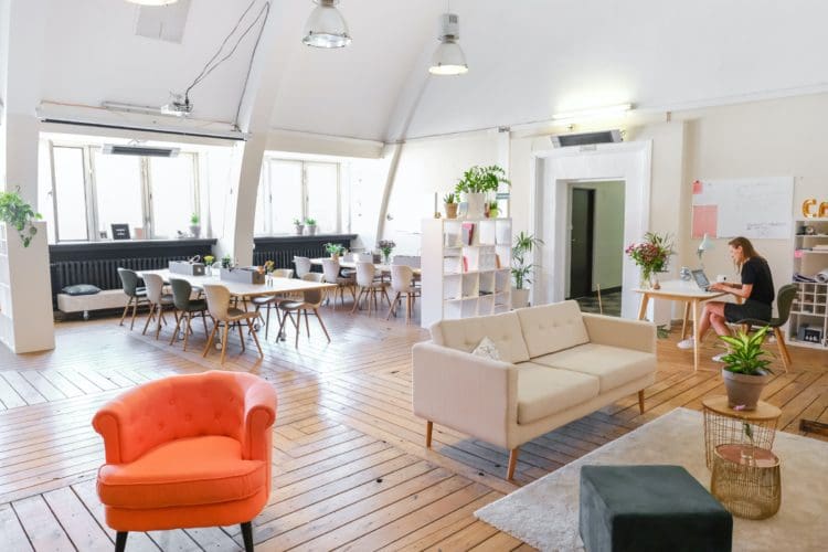 Resimercial coworking office design with sofas and desks