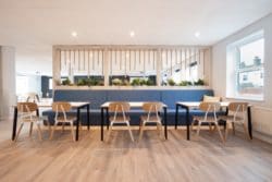 Banquette seating with integrated power for an office breakout area design