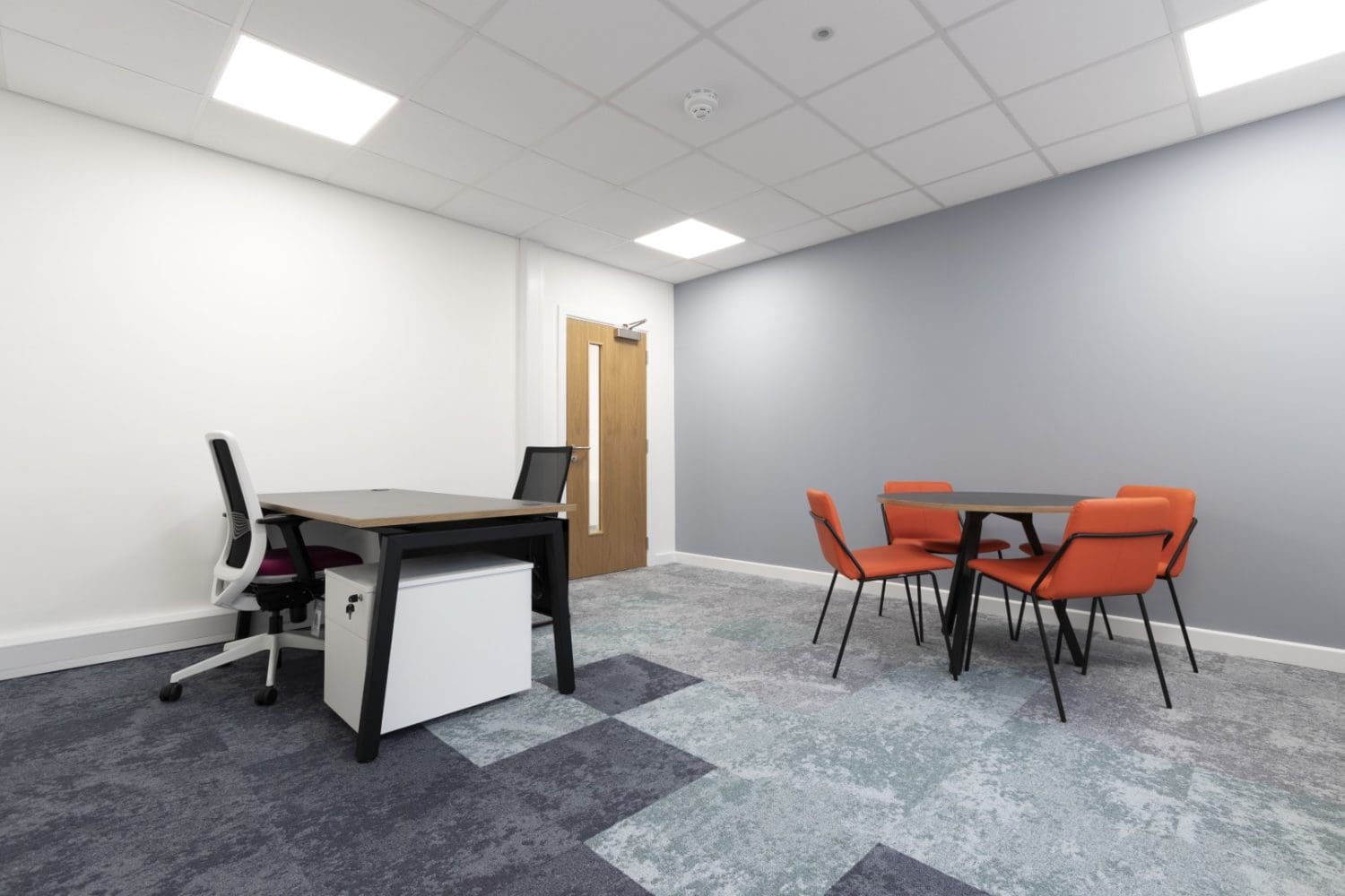 Executive office design with a work desk and coffee table