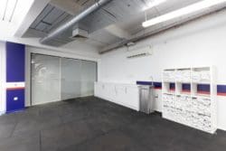 Gym storage area with a towel stand and water fountain