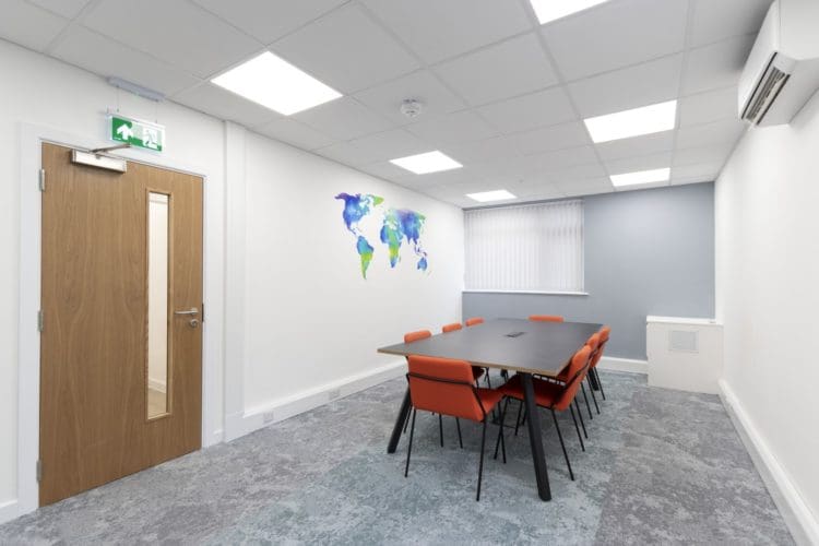 Office boardroom design with mottled carpet and collaboration table