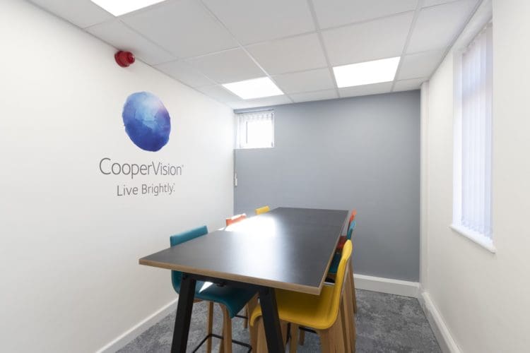 Office meeting room design with company branding and a Frovi desk