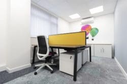 Two person office desk with screen and pedestals