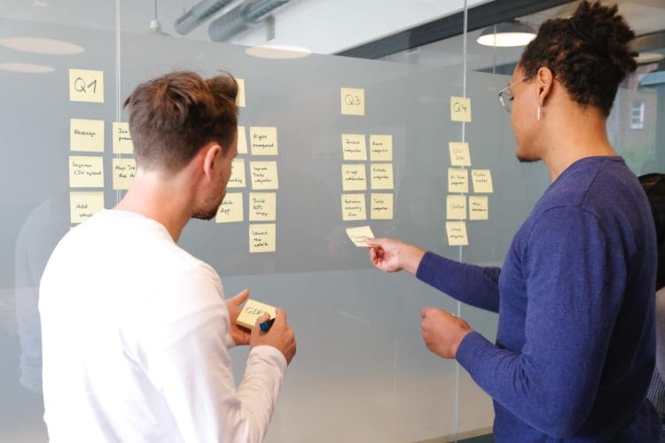 Office workers being collaborative