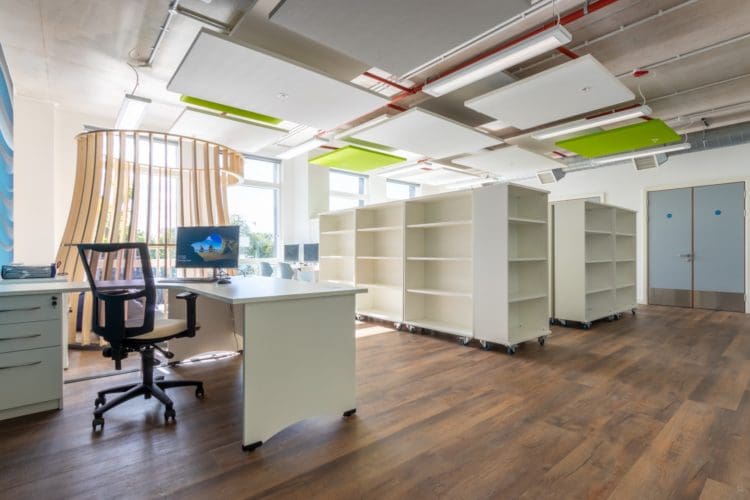 School library interiors with bespoke shelving and ceiling acoustics