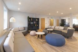 Office breakout area with modular sofas and a bespoke storage unit