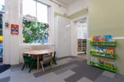 Classroom design with gloss fronted whiteboard storage