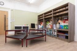 Classroom with multi-functional furniture and an arts and crafts station