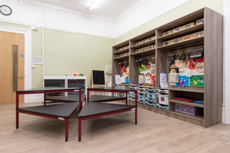 Classroom with multi-functional furniture and an arts and crafts station