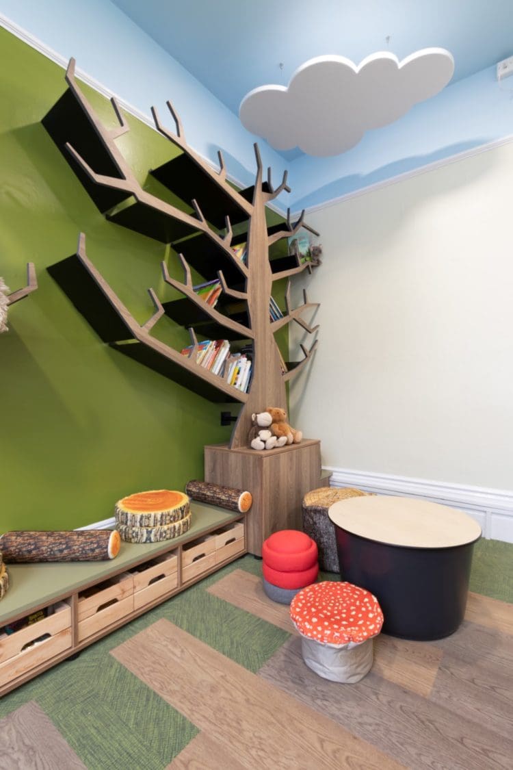 Woodland forest library feature wall at Oakfield Prep School in West Dulwich