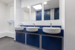 School toilet interior design with new basins and mirrors