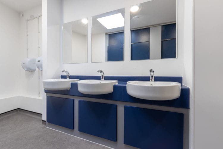 School toilet interior design with new basins and mirrors