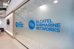 Glass office partition with company branding installed for a reception refurb