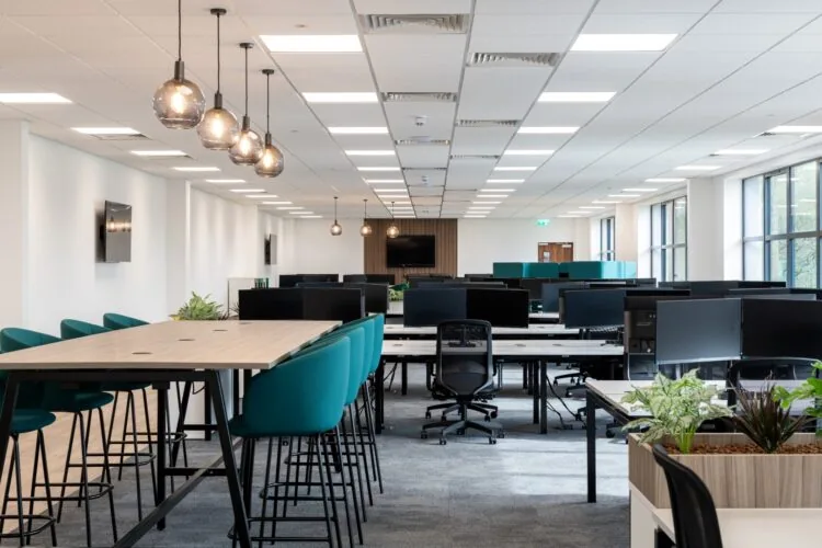 A sleek and modern office interior design with meeting tables and office desking, by Rap Interiors for Albion Fine Foods.