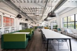 Staff dining space with varied furniture solutions at food suppliers' warehouse in Kent.