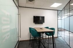 Meeting room design with poseur height collaboration table and stools.