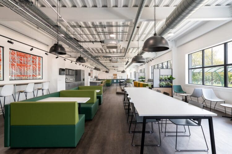Staff dining space with varied furniture solutions at food suppliers' warehouse in Kent.
