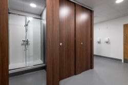 Toilet and shower cubicles in staff washroom design and fit out project at Albion Fine Foods, Dartford. Fit out completed by interior design specialists Rap Interiors.