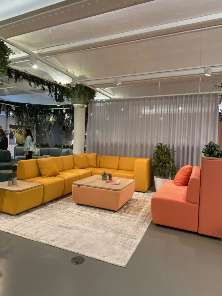 Dvison Highley's showroom in Clerkenwell, London, showcasing bright yellow and coral soft seating solutions.
