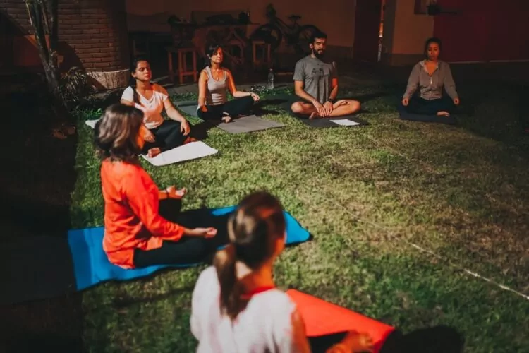 Group yoga and meditation session to promote wellbeing amongst employees at work.
