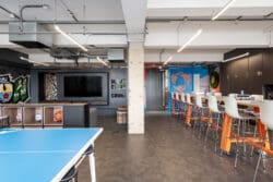 Breakout space and communal kitchen area in London office refurbishment project.