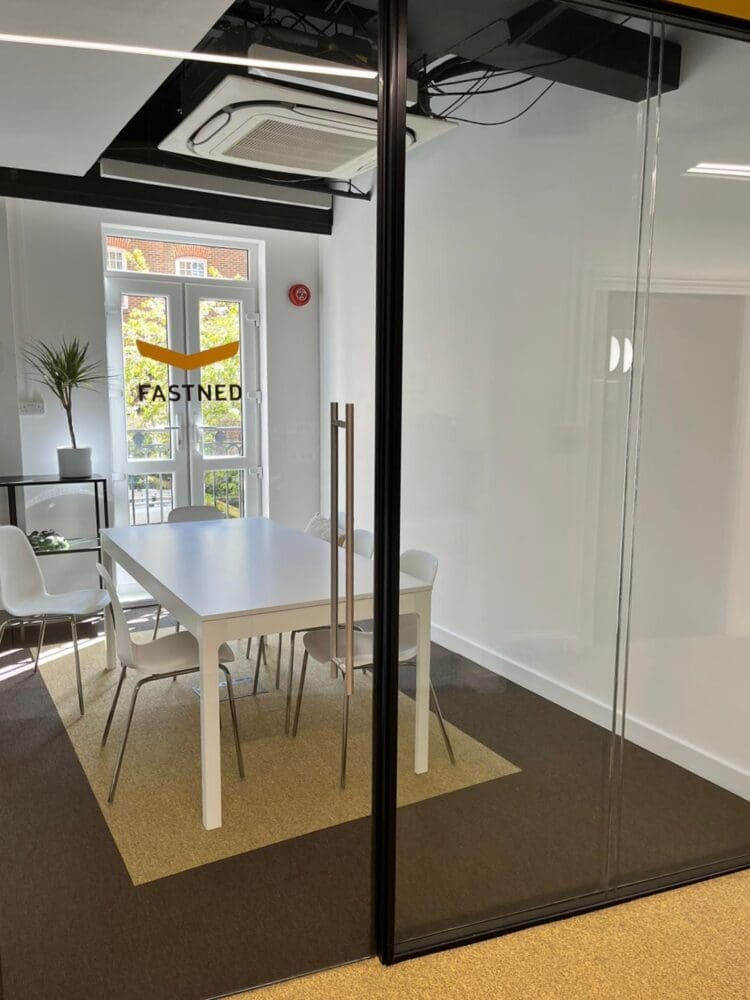 Meeting room with company branded glass manifestation.