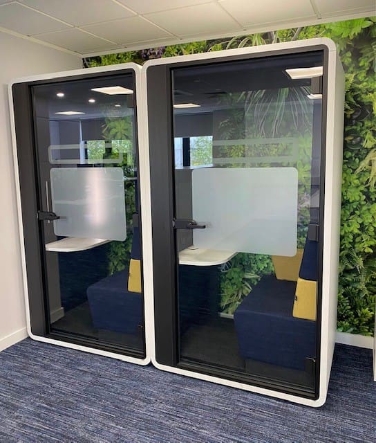 Office pods for privacy and independent work.