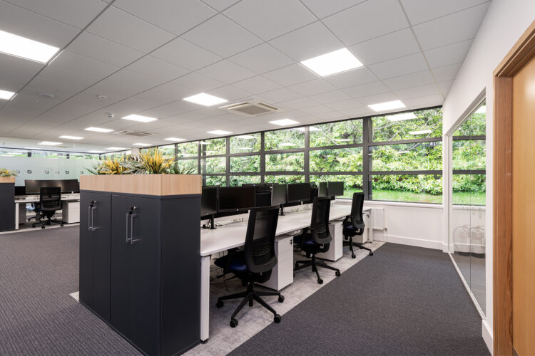 Bright modern office interior design with modern desking and storage units.