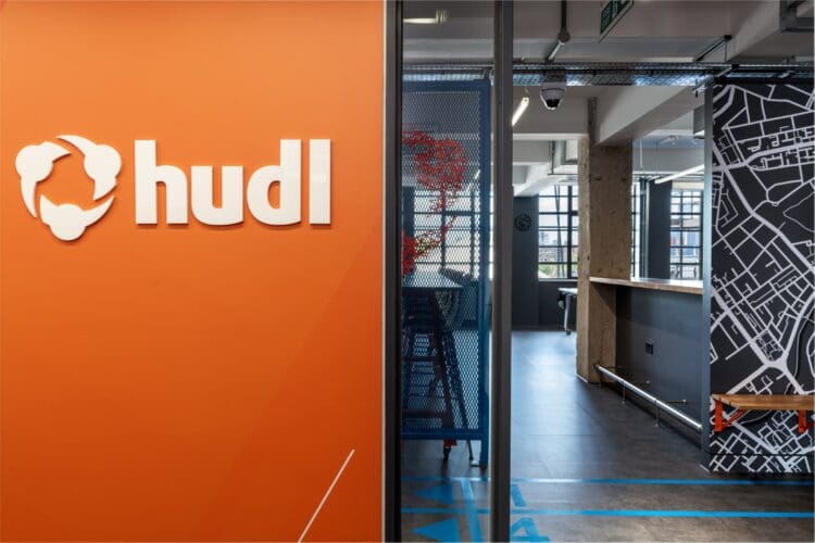 Company branded office lobby area in office refurbishment project.