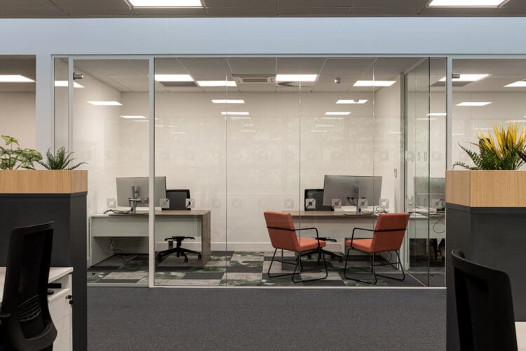 Glass fronted office with branded manifestation.