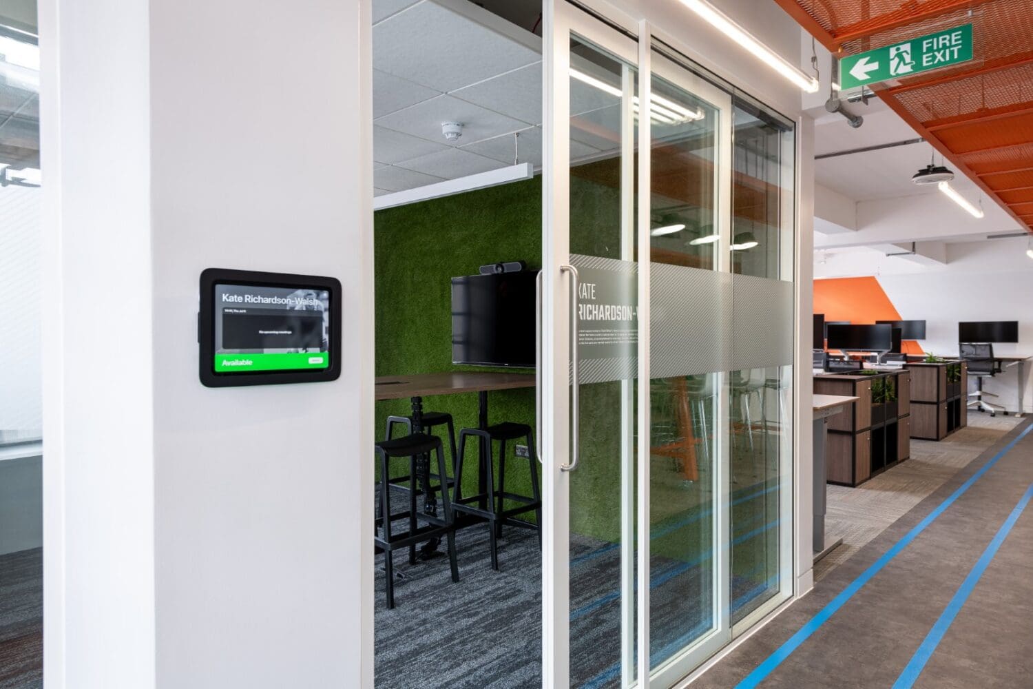 Glazed fronted meeting room with branded manifestation in London office refurbishment.
