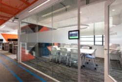 Glazed fronted meeting room with manifestation.